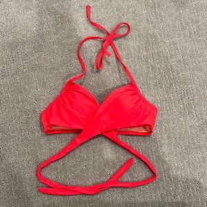 Victoria’s Secret neon red cross back bikini top, size 32B. Worn once.